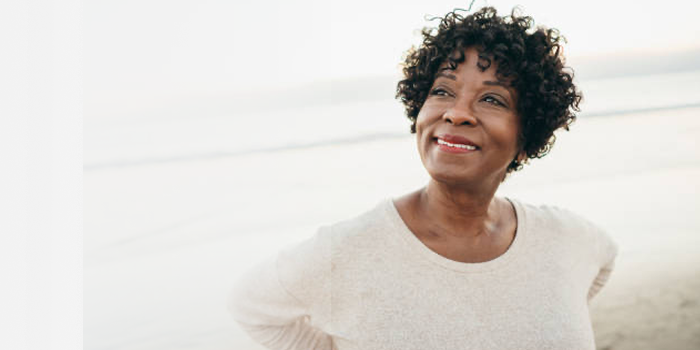 Hopeful woman on beach
